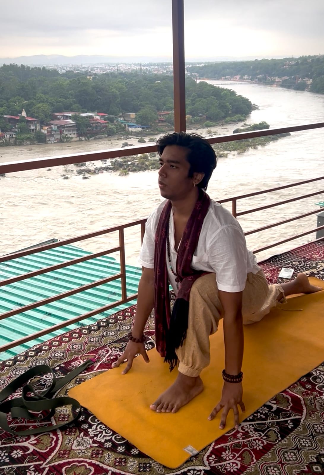 Yoga practice on a rooftop overlooking the Ganga in Rishikesh
